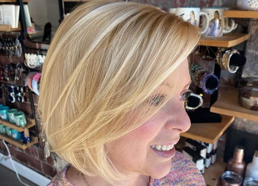 older woman with short layered blonde bob
