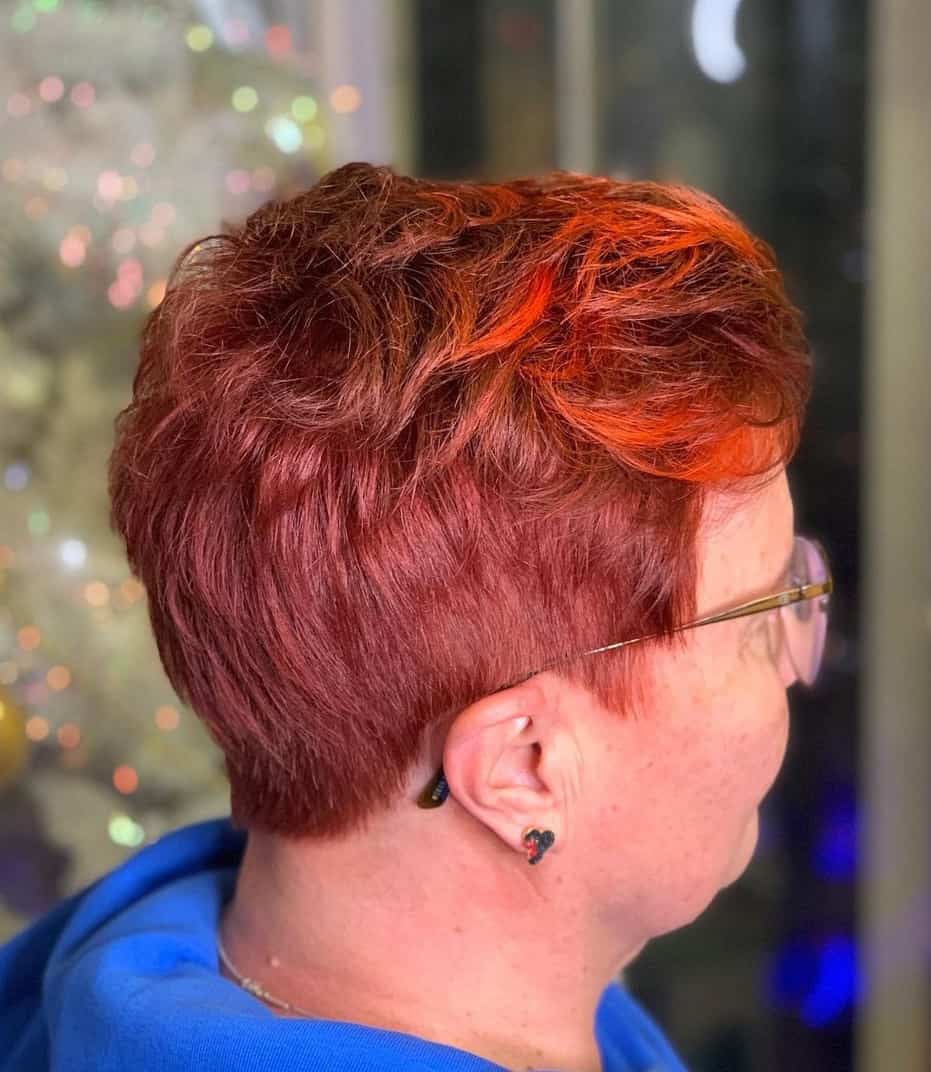 short layered red hairstyle for women over 50