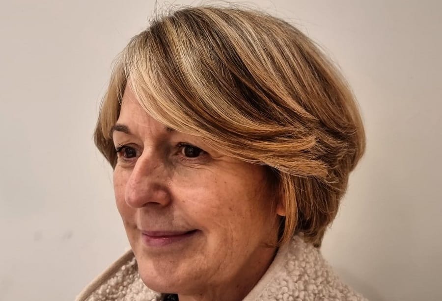 short layered blonde bob with highlights for women over 50