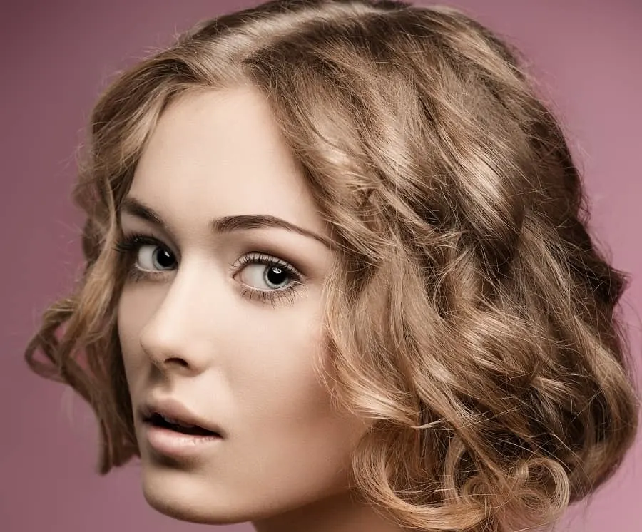 curly layered bob with sandy blonde hair