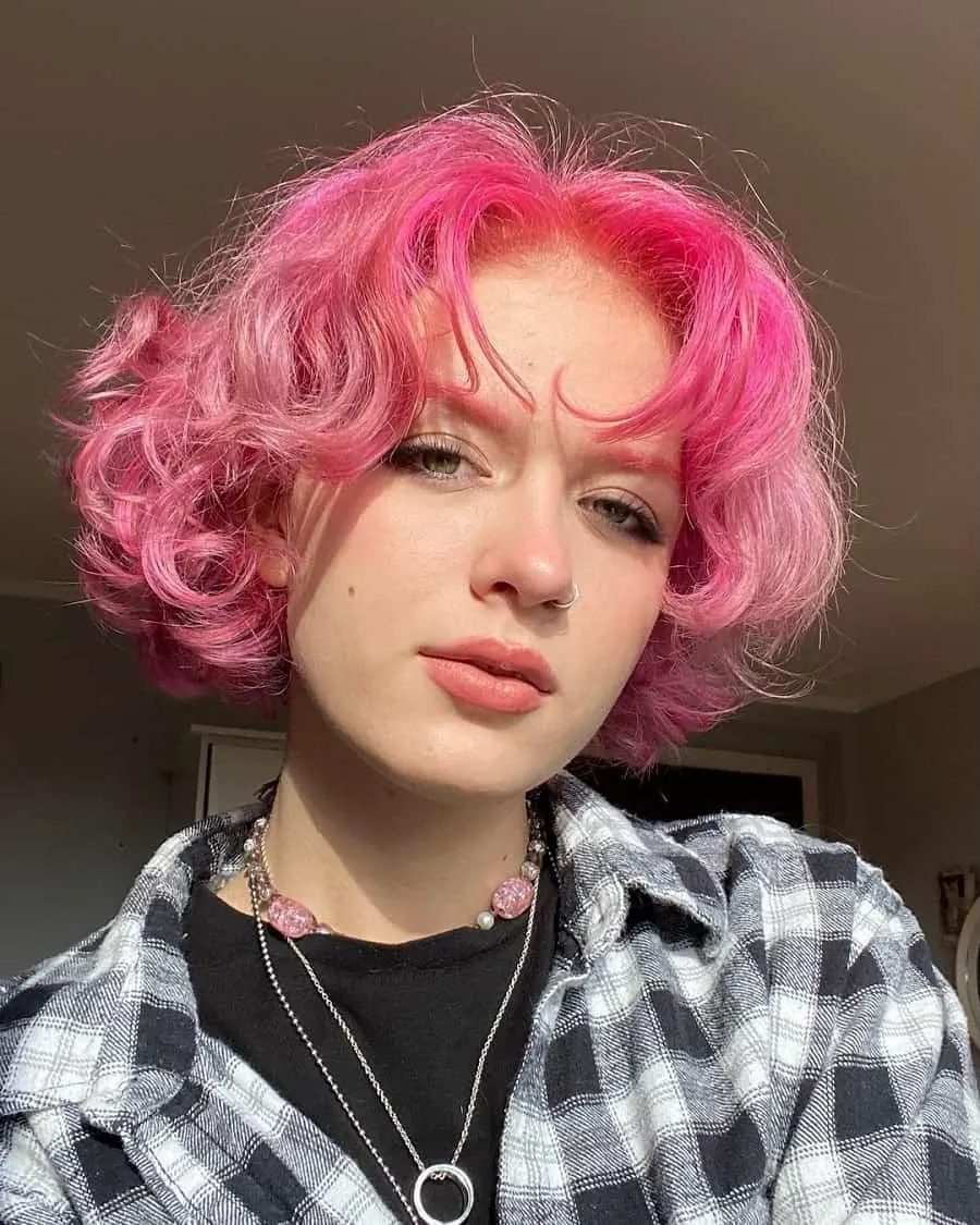 woman with curly pink bob