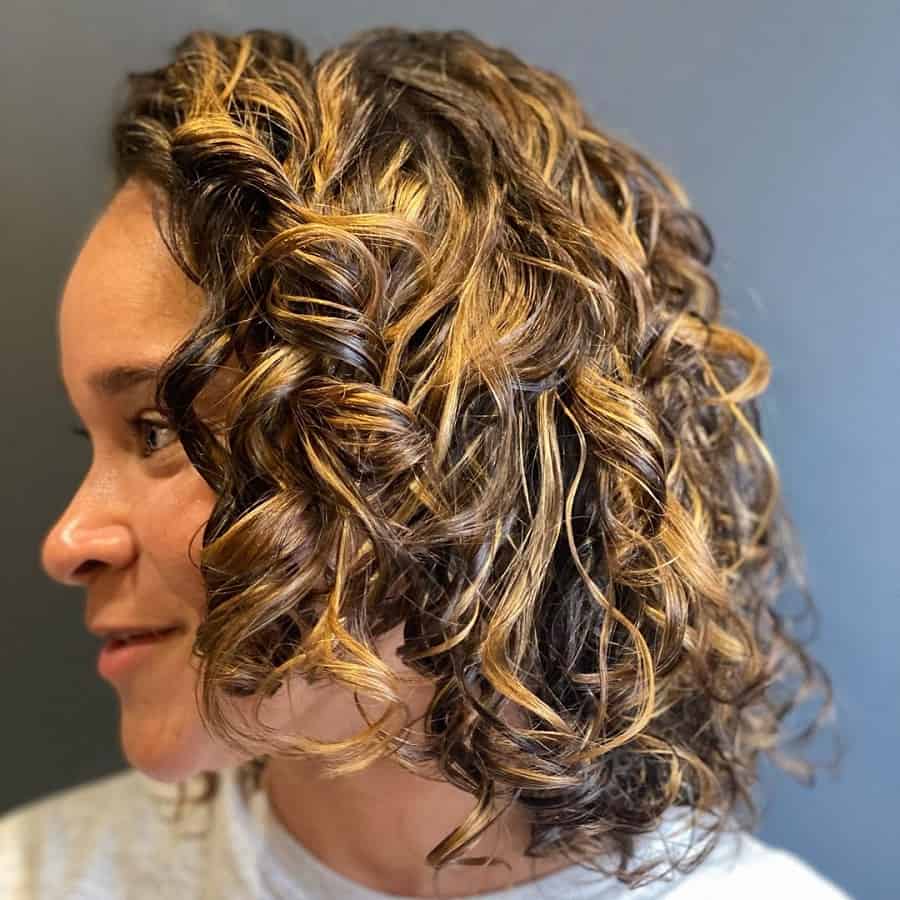 curly bob with blonde highlights