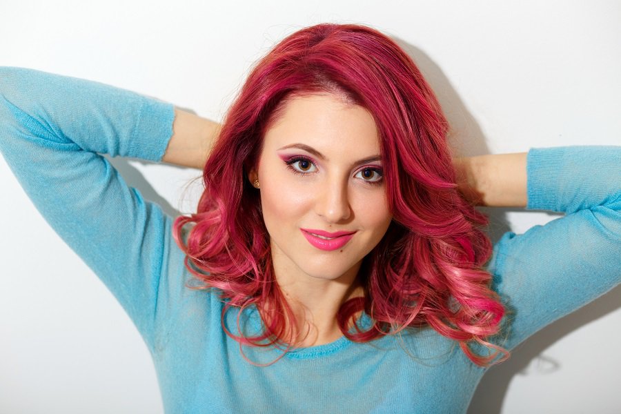 medium wavy dark pink hairstyle for women