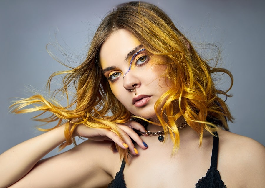 long layered brown hair with yellow highlights