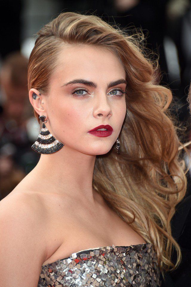 Cara Delevingne Wavy Side Swept Hairstyle