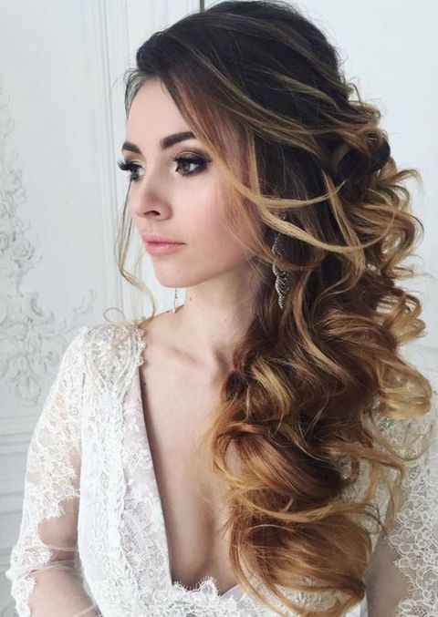 Large Curly Side Swept Hairstyle