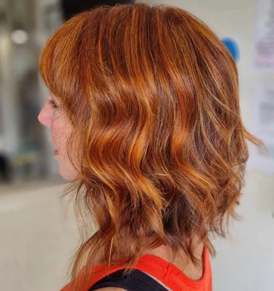 wavy ginger red long bob with highlights
