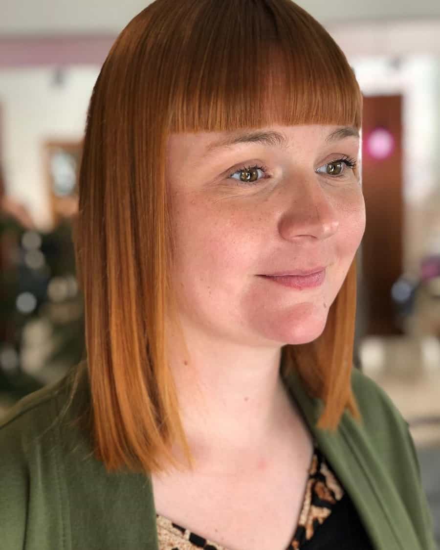 straight blonde long bob with blunt bangs
