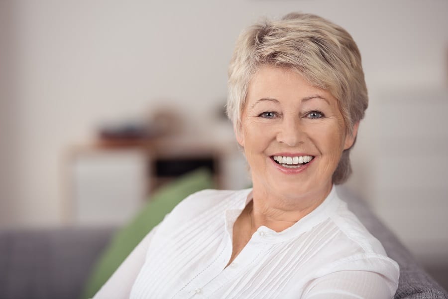 short layered blonde hairstyle for older women