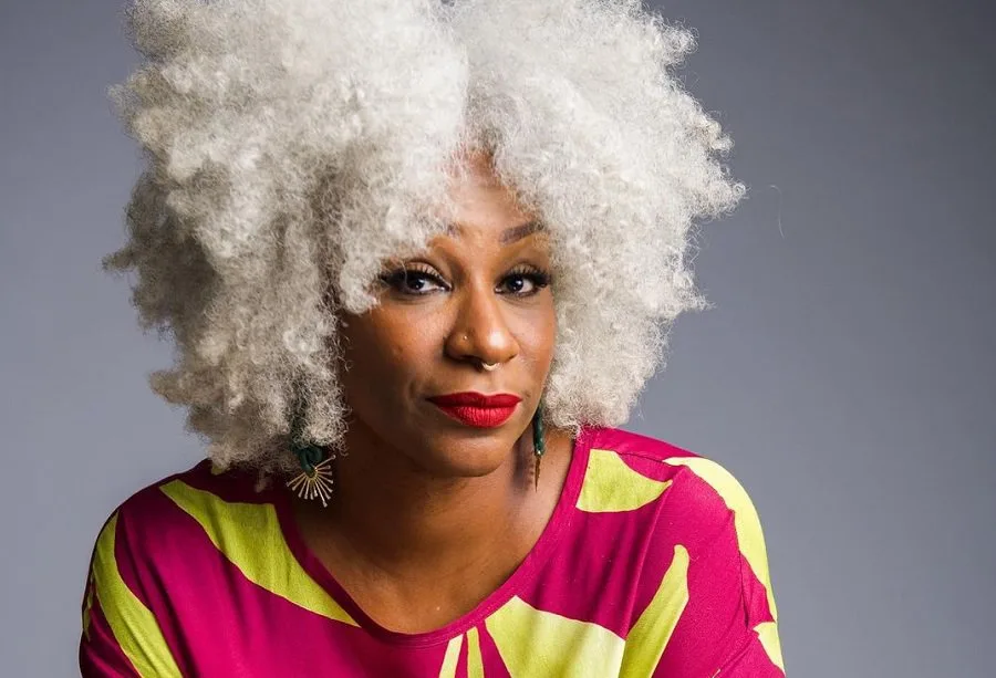 black woman over 50 with blonde afro hair