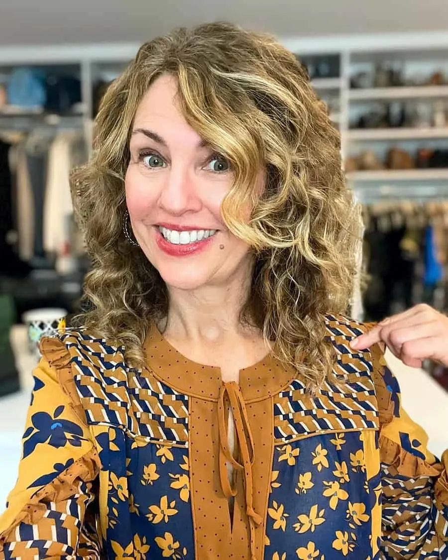 curly medium hair with highlights for women over 50