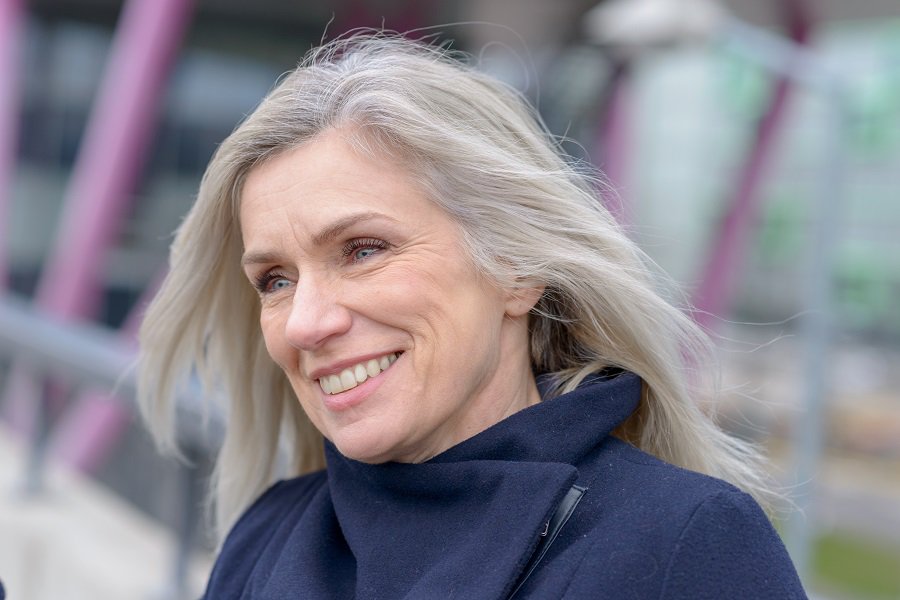 woman over 50 with long grey hair