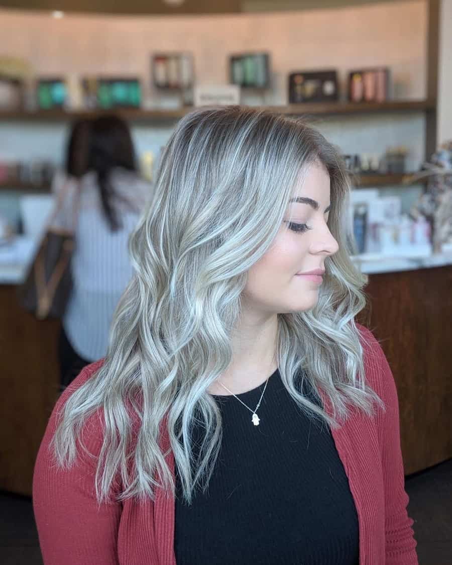 woman's wavy hair with ice blonde highlights