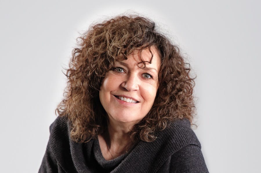older women curly hairstyle with bangs