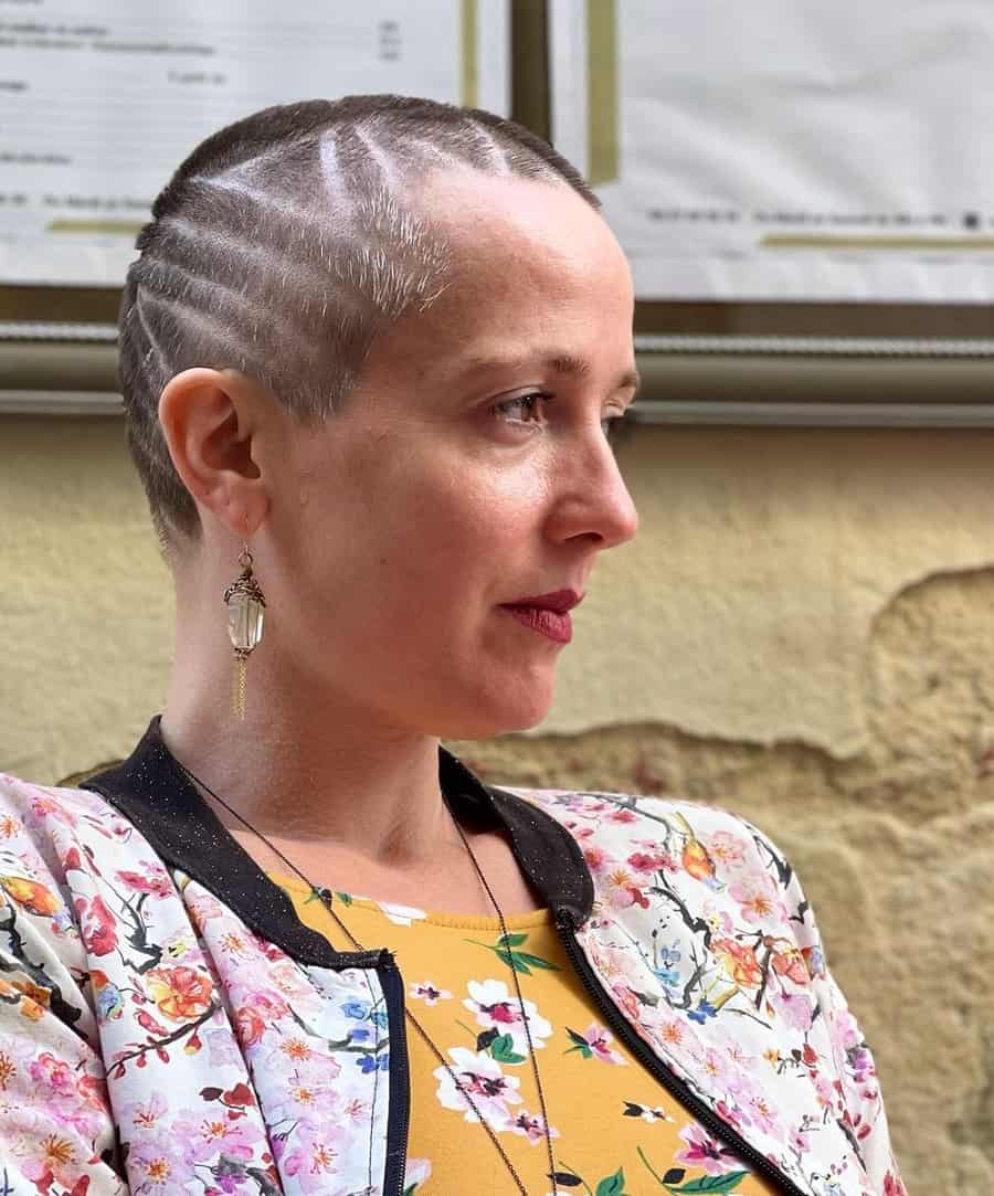 woman with very short buzz cut with design