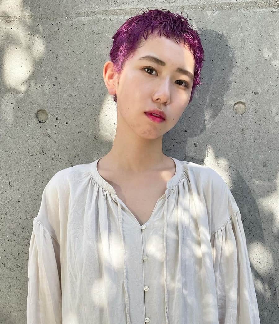 Asian woman with very short purple pixie cut