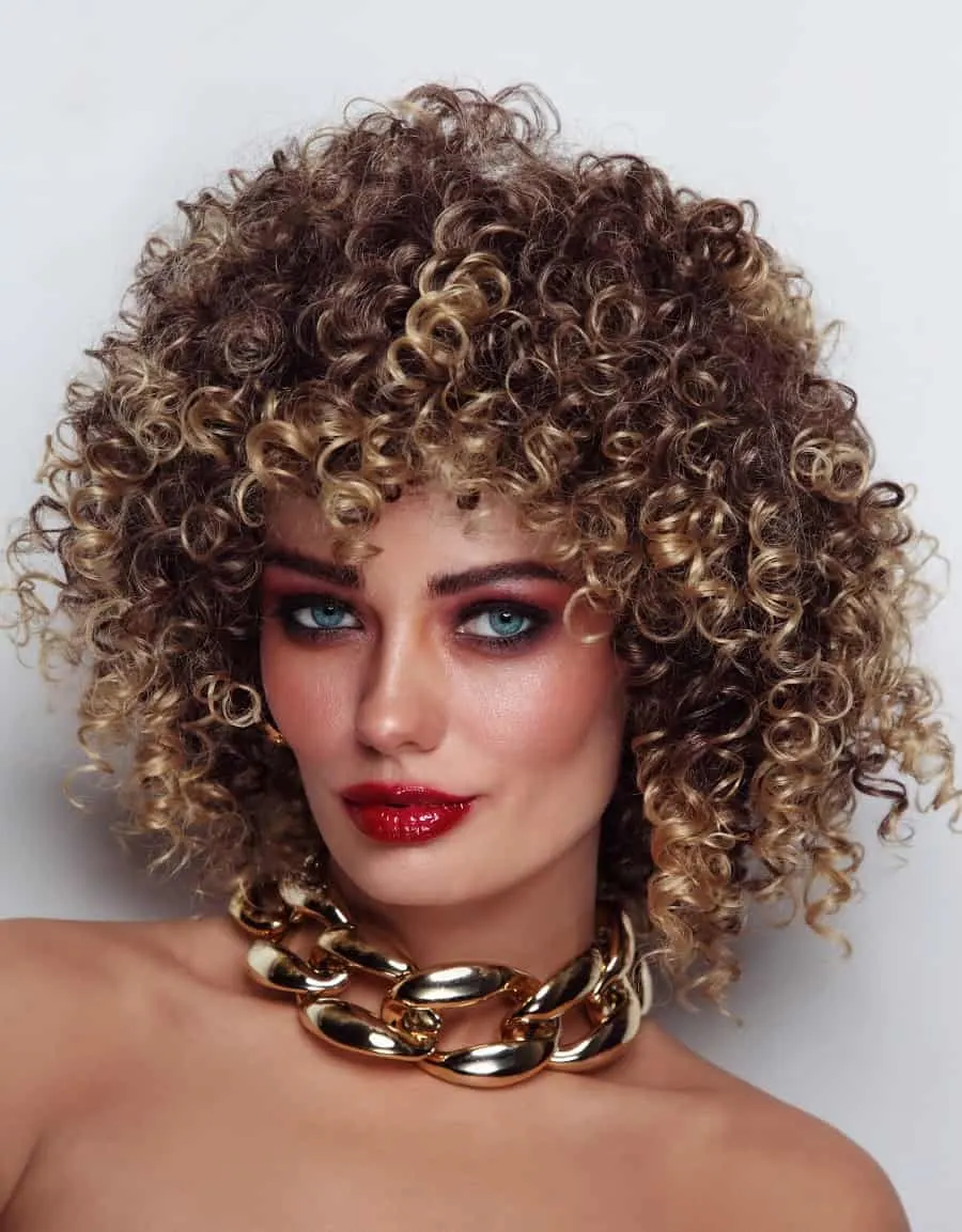curly afro hair with golden blonde highlights