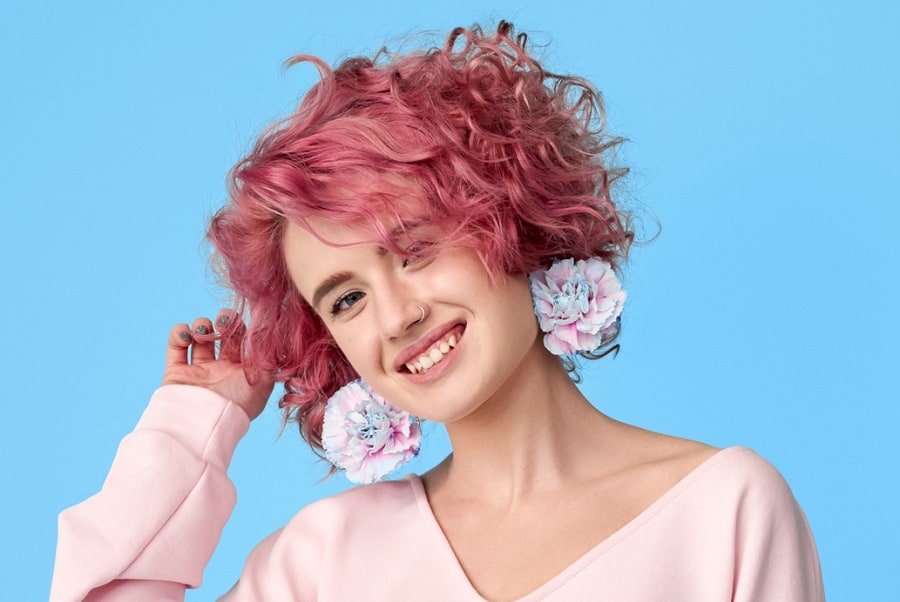 teenage girl with short wavy pink hair
