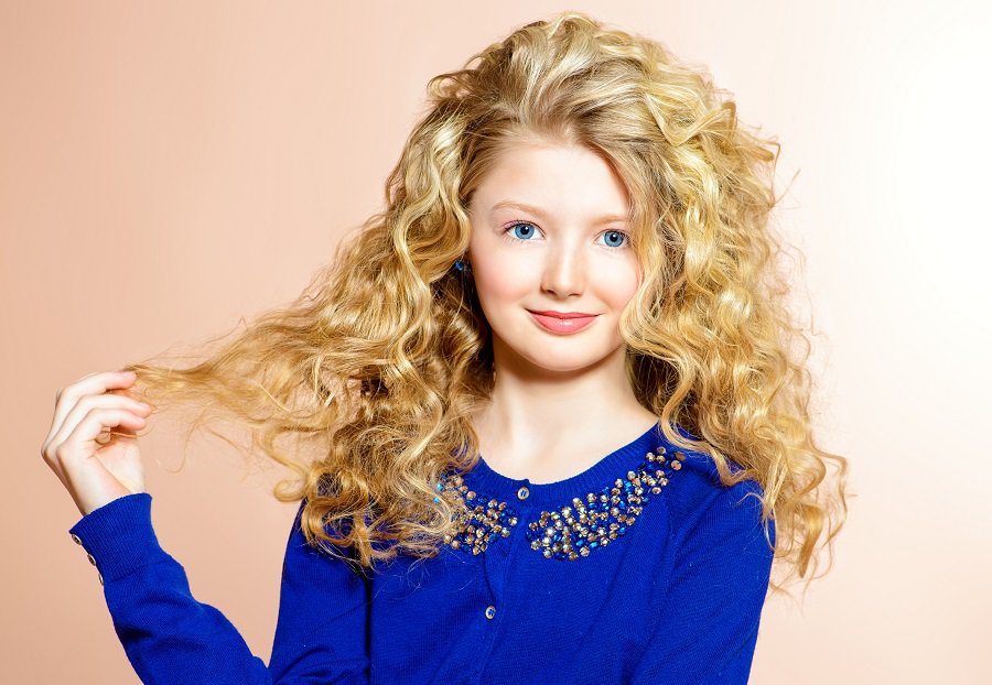 teenage girl with thick curly blonde hair