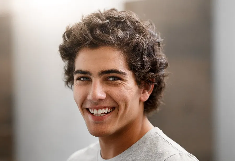 thick curly hairstyle for young men