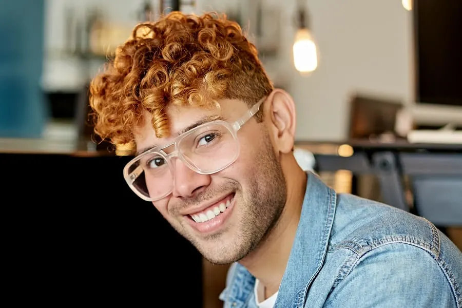young guy with ginger red curly hair