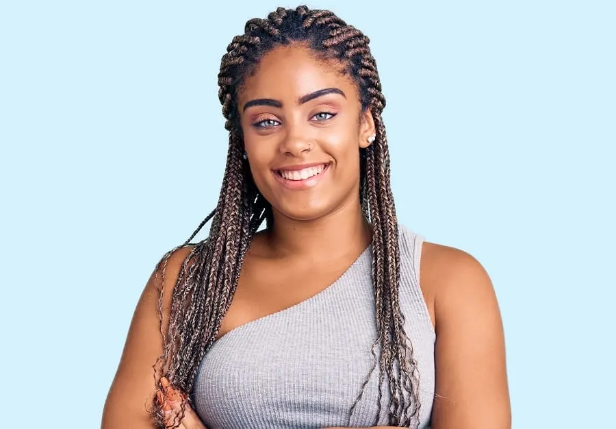 black woman with thin crochet braid hairstyle