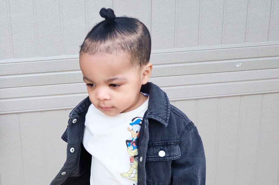 toddler boy with cute bun hairstyle