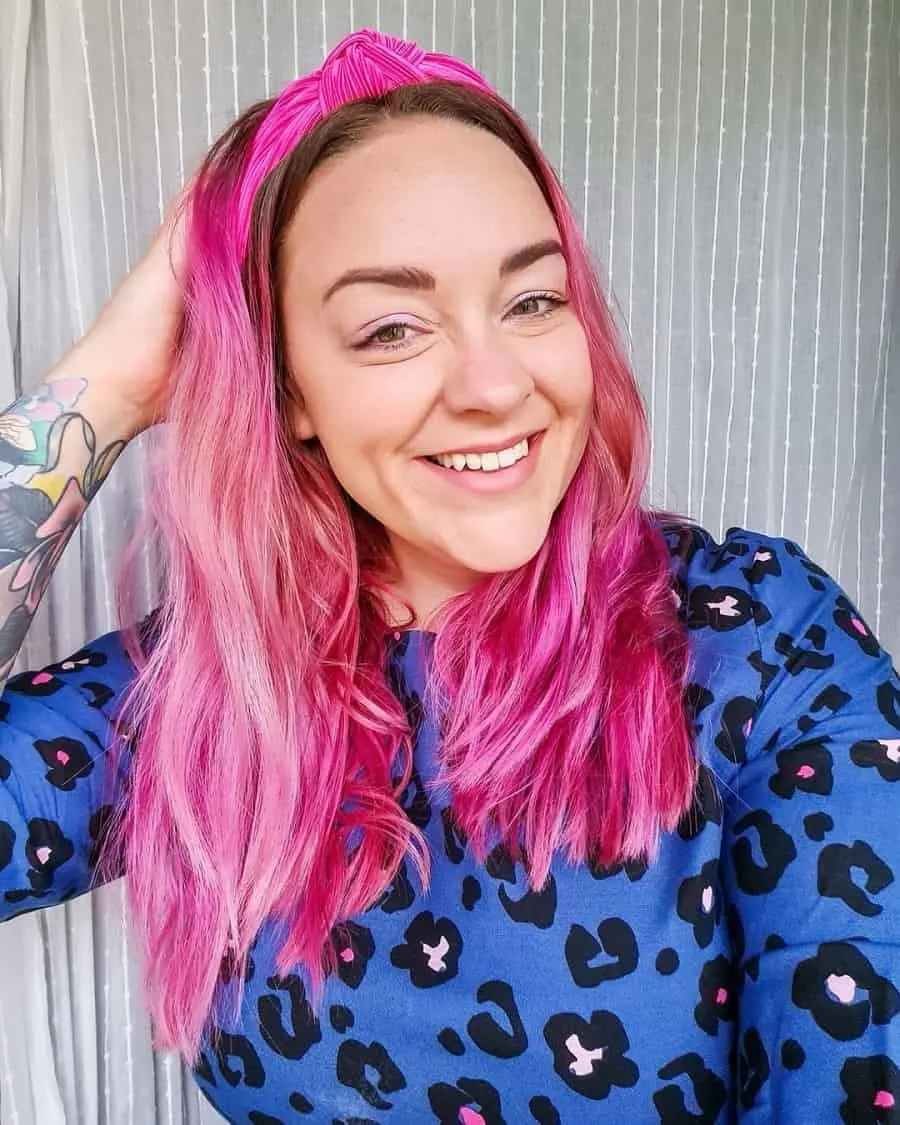 fall hairstyle with wavy pink hair