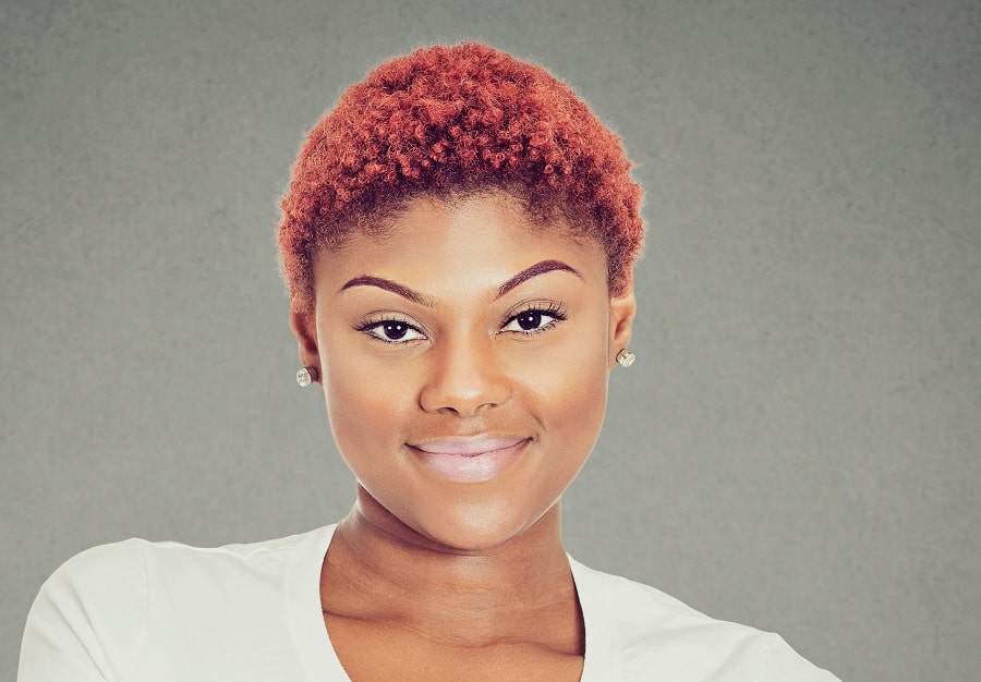 black woman with short red afro hair