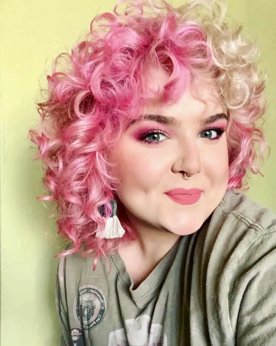 woman with mid length curly pink hair