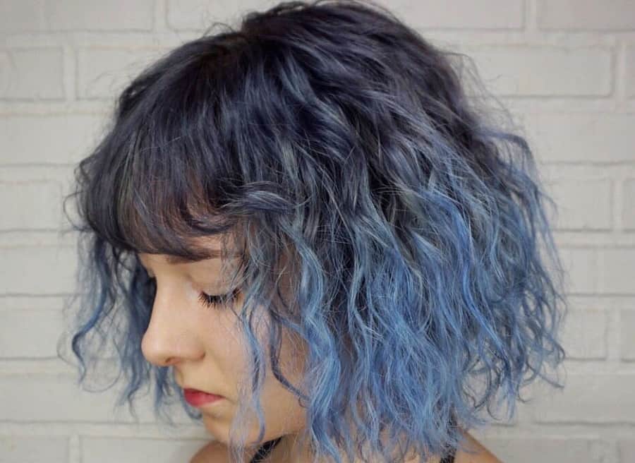 mid length curly bob with bangs
