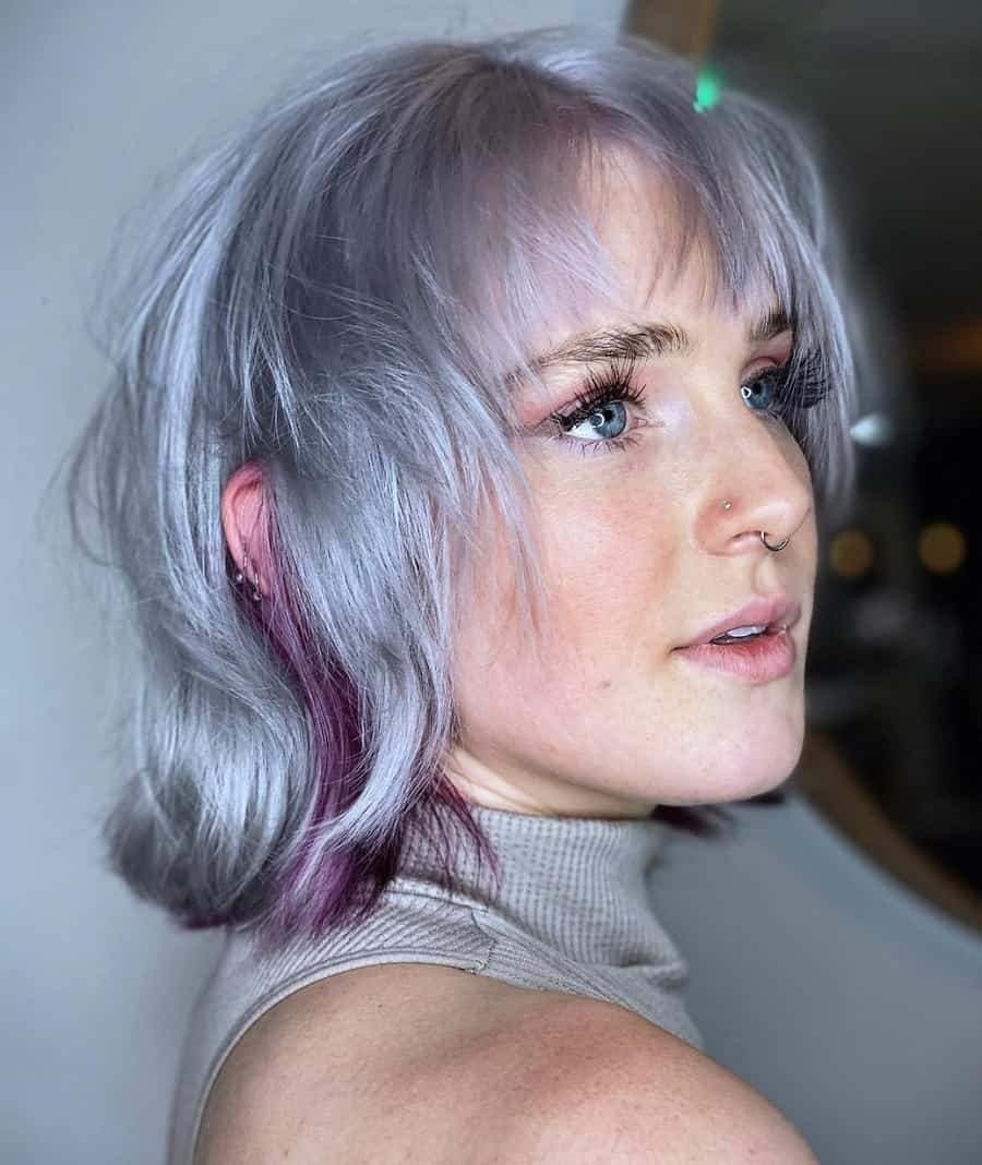 woman with messy silver bob