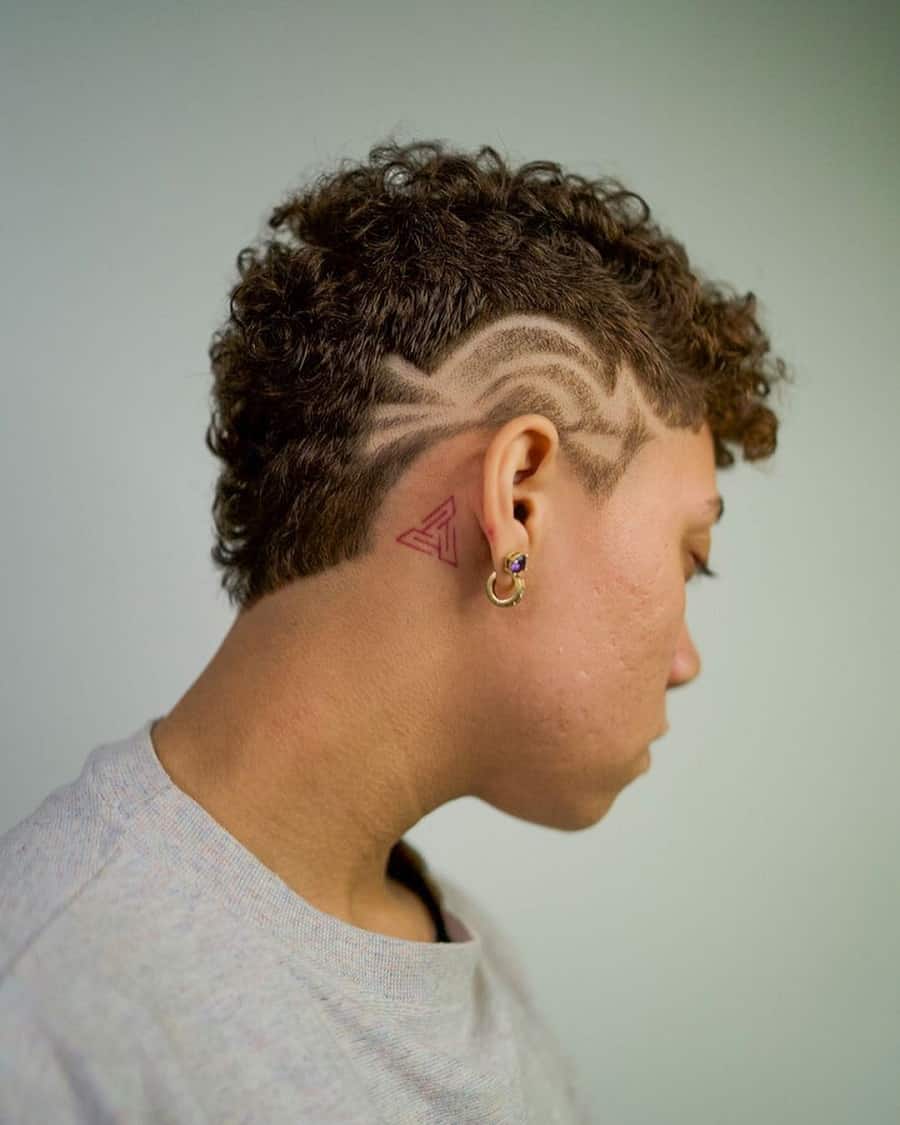 androgynous haircut with design