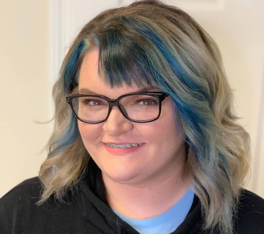  plus size woman with medium hair and highlights