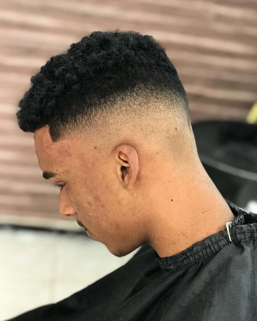 black guy with mid taper fade
