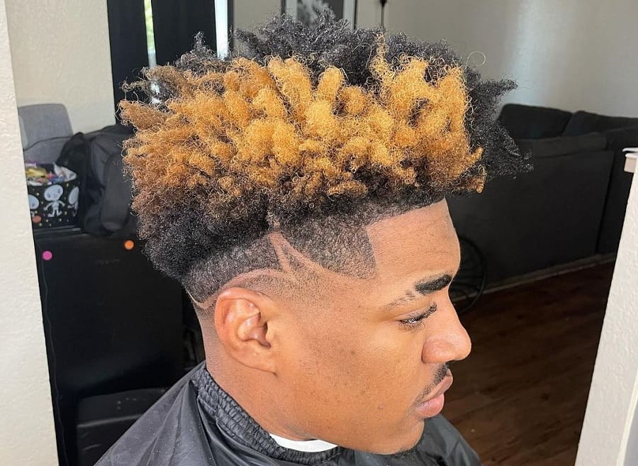 curly taper fade with blonde highlights