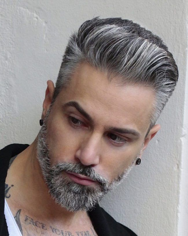 Free Photo | Portrait of courageous and fashionable male model with long  trendy beard and undercut hairstyle. caucasian blond man in grey t-shirt  looking sullenly ahead of him. indoors shot on white .