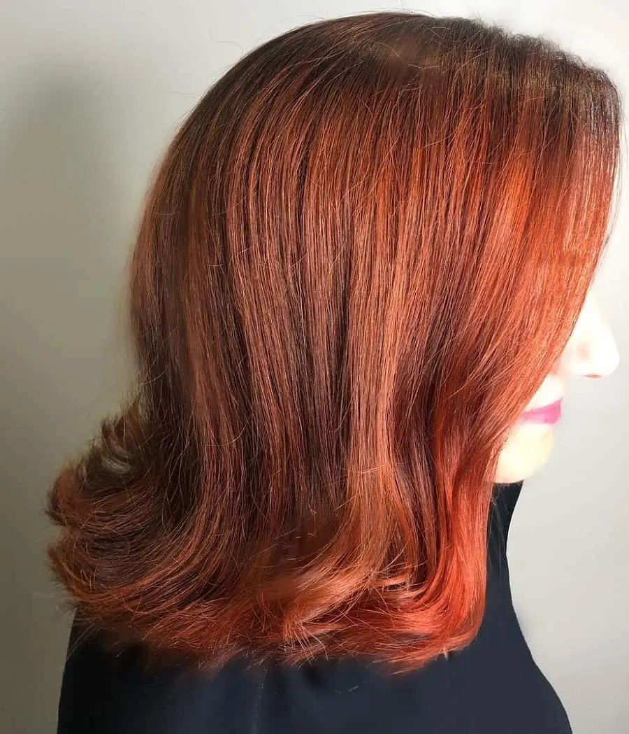 flip hairstyles with copper red hair