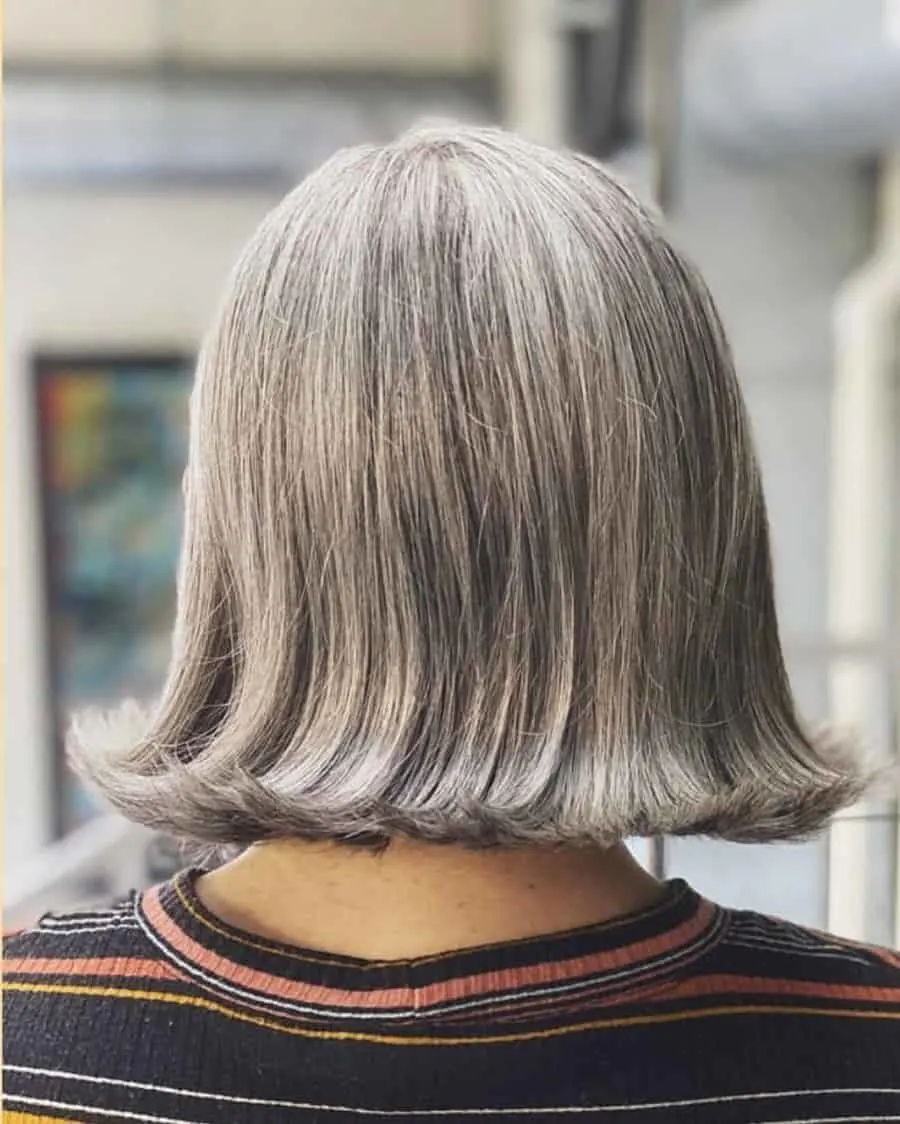 flip hairstyle with grey bob