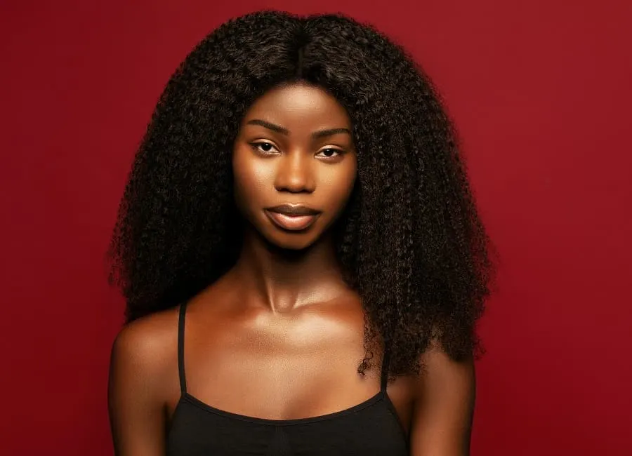 black woman with middle part natural hairstyle