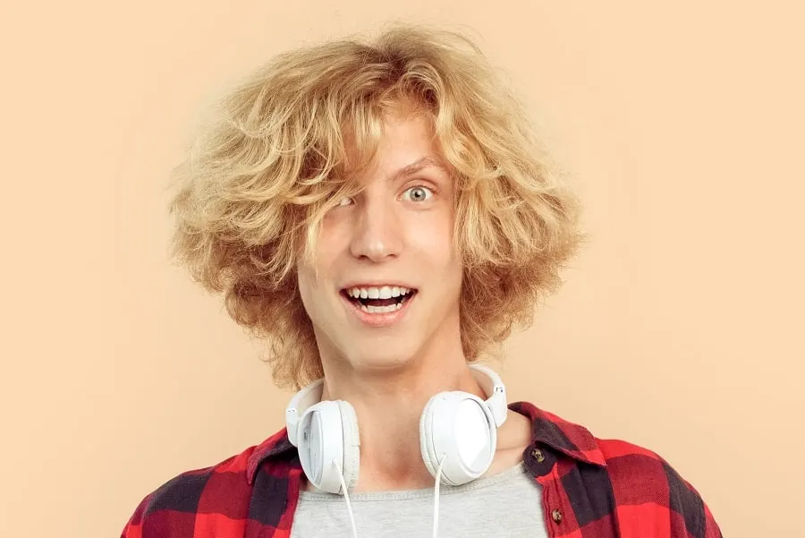 young guy with curly blonde long hair