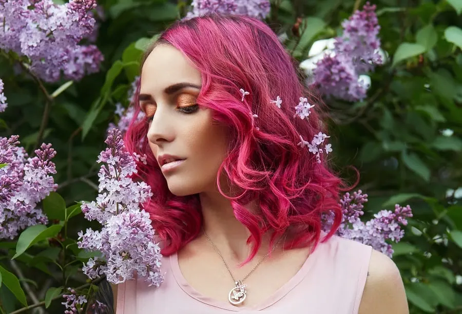 curly layered long bob with pink hair