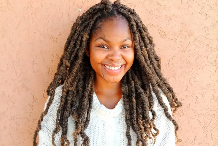 black woman with thick locs hairstyle