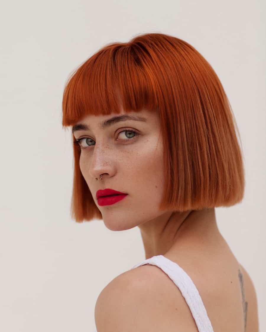 red blunt bob with bangs