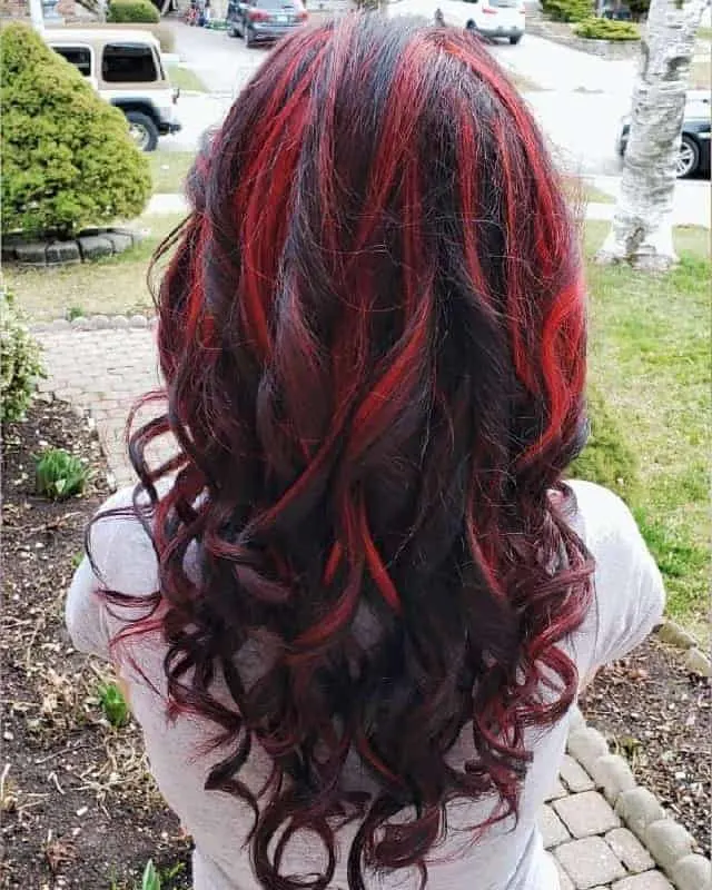 brown curly hair with red highlights