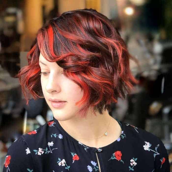wavy brown hair with red highlights