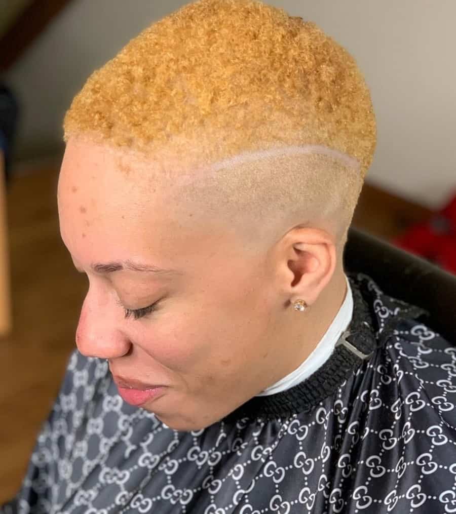 short curly blonde hair with high bald fade