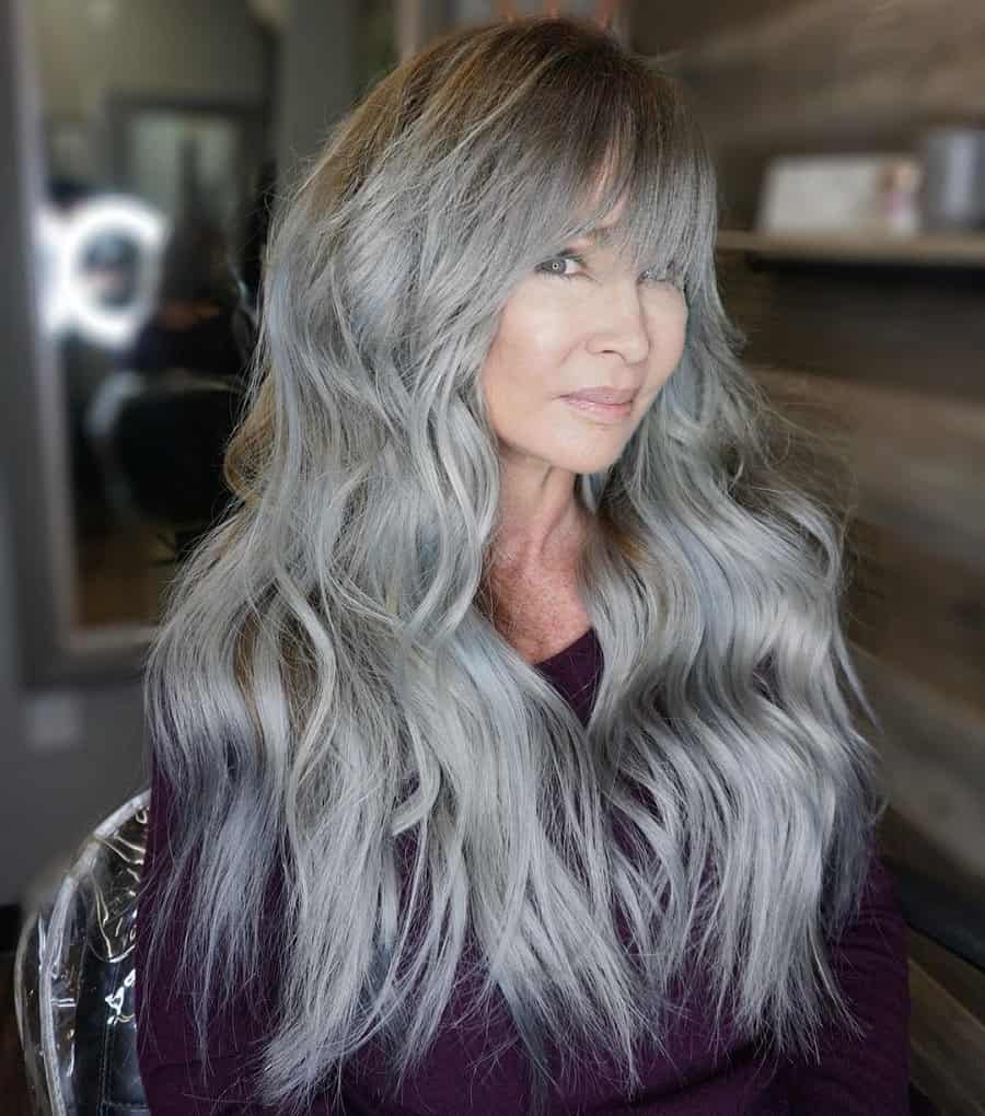 long layered gray hair with bangs for older women