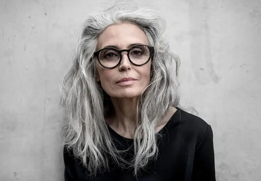 older woman with gray hair and glasses