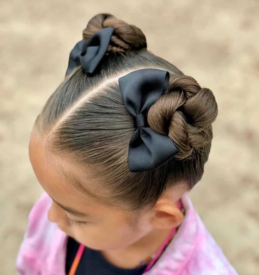 little girl with space bun hairstyle